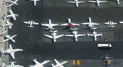 Limousine taking customers to private jet ramp